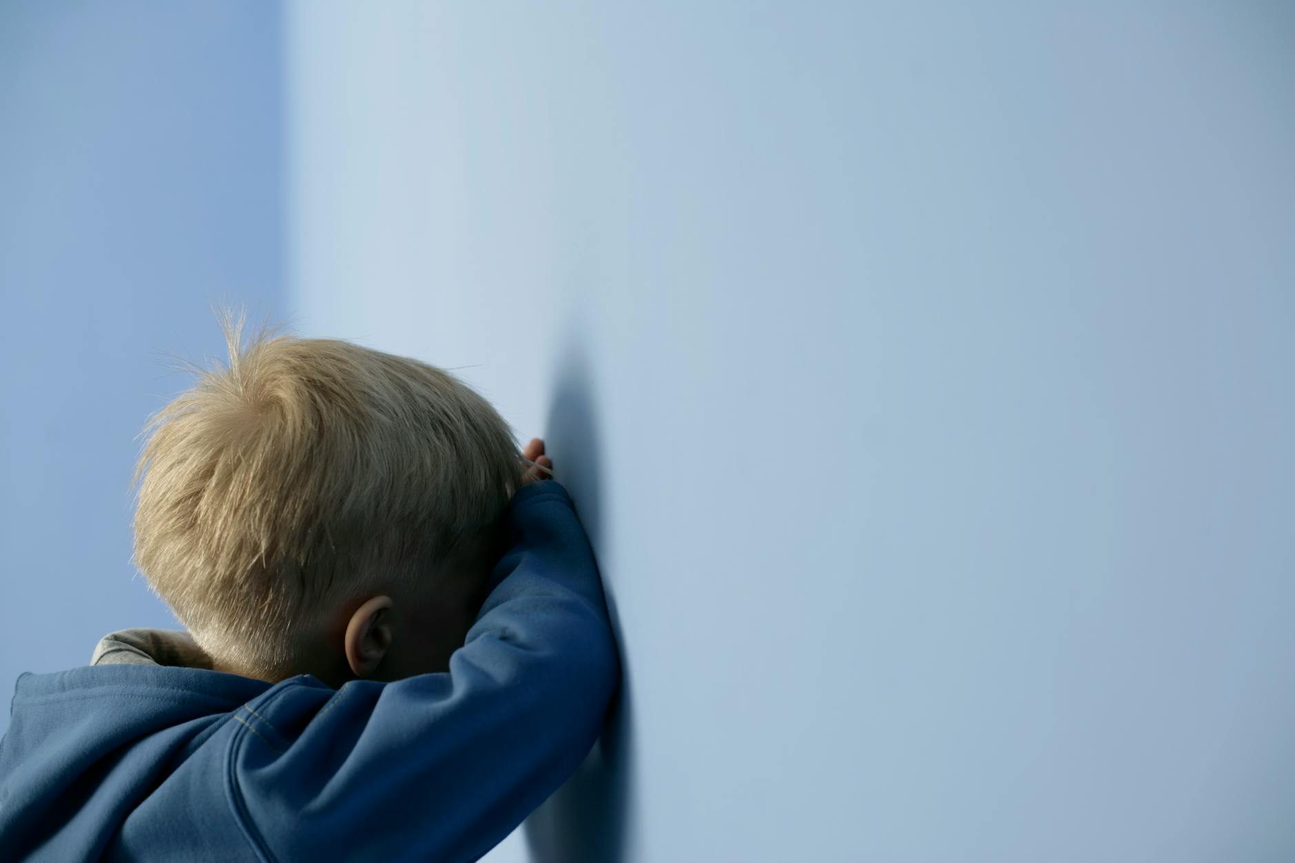 sad girl against wall